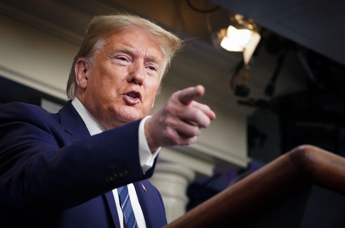 President Donald Trump gestures as he speaks during the daily briefing on the CCP virus, in the Brady Briefing Room of the White House in Washington on April 21, 2020. (Mandel Ngan/AFP via Getty Images)