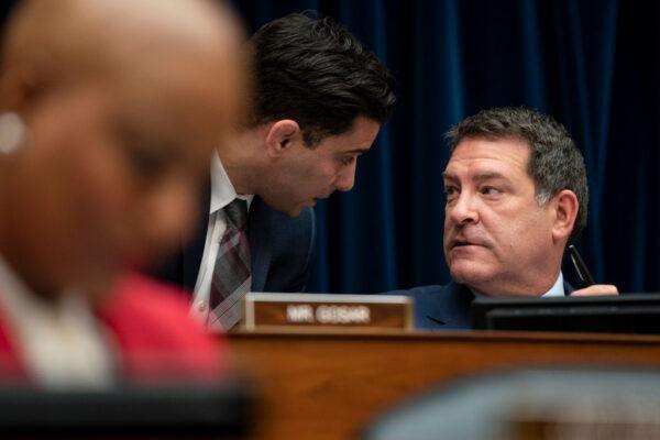 Rep. Mark Green (R-Tenn.) (R) confers with an aide during a House Oversight and Reform Committee hearing in the Rayburn House Office Building on Capitol Hill in Washington, on March 11, 2020. (Drew Angerer/Getty Images)