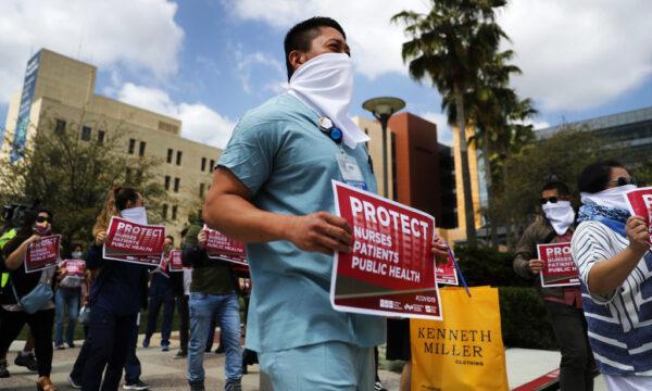 Nurses and supporters protest about the lack of personal protective gear available at UCI Medical Center amid the CCP virus pandemic in Orange, Calif., on April 3, 2020. (Mario Tama/Getty Images)