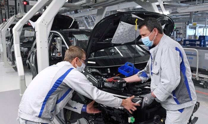 With Masks and Distancing, Volkswagen Restarts Production