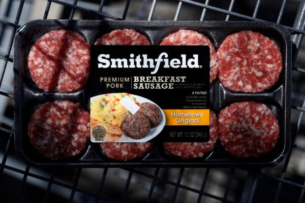 A package of Smithfield Foods breakfast sausage sits in a shopping cart outside of a local grocery store, in Des Moines, Iowa, on April 14, 2020. (Charlie Neibergall/AP)