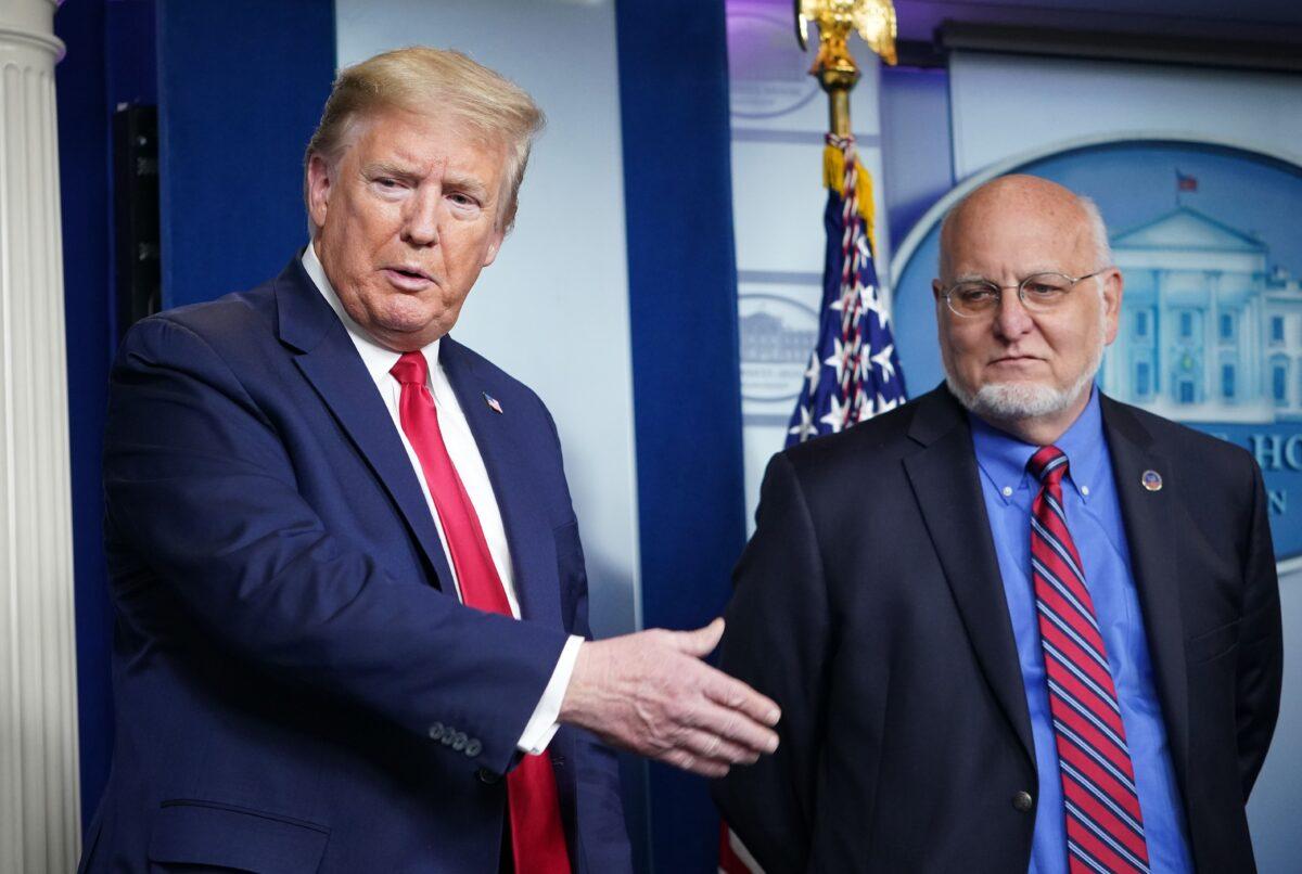 President Donald Trump, left, and CDC Director Robert Redfield participate in a CCP virus briefing in the Brady Briefing Room of the White House in Washington on April 22, 2020. (Mandel Ngan/AFP via Getty Images)
