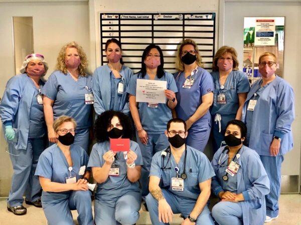 Medical staff pose with a thank-you note for masks donated by Hedley & Bennett. (Courtesy of Hedley & Bennett)