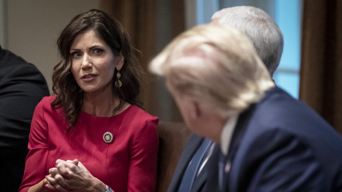 South Dakota Gov. Kristi Noem speaks as President Donald Trump listens during a meeting about the Governors Initiative on Regulatory Innovation in the Cabinet Room of the White House in Washington on Dec. 16, 2019. (Drew Angerer/Getty Images)