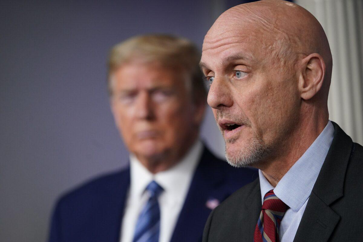 FDA Commissioner Stephen Hahn speaks as President Donald Trump listens during the daily briefing on the CCP virus in the Brady Briefing Room of the White House in Washington on April 21, 2020. (Mandel Ngan/AFP via Getty Images)