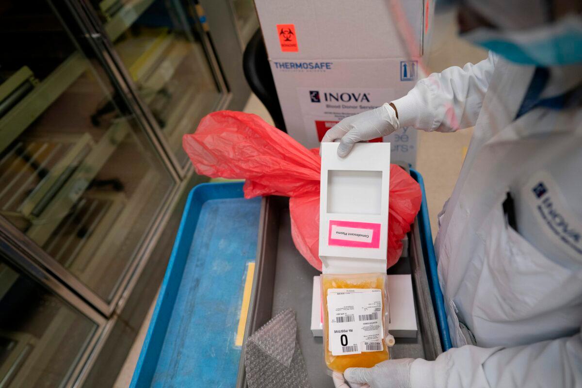 A lab technician freeze packs donated convalescent plasma donated by recovered COVID-19 patients for shipping to local hospitals at Inova Blood Services in Dulles, Va., on April 22, 2020. (Alex Edelman/AFP via Getty Images)