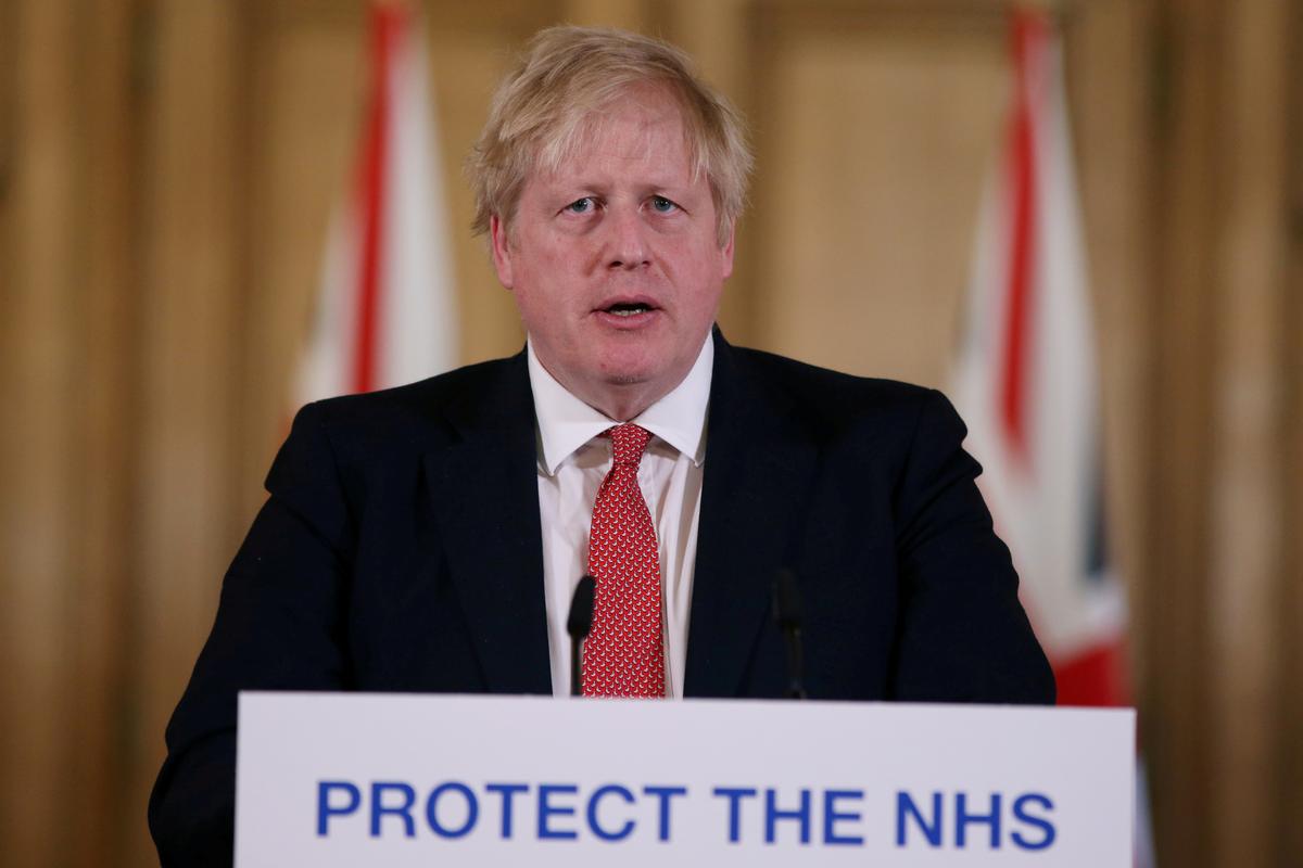 Prime Minister Boris Johnson speaks during a news conference on the ongoing situation with the COVID-19 in London, Britain, on March 22, 2020. (Ian Vogler/Reuters)