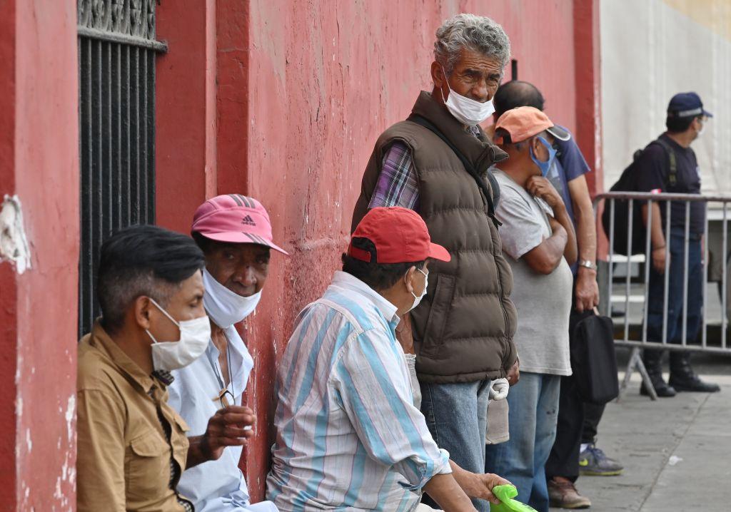 Homeless wait upon arriving at a shelter set up at the bicentennial Acho Bullring in Lima for the duration of the CCP virus on March 31, 2020. (CRIS BOURONCLE/AFP via Getty Images)