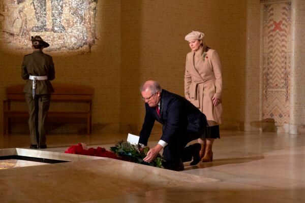 Australian Prime Minister Scott Morrison, accompanied by his wife Jenny, lays a wreath in the Hall of Memory during Anzac Day Commemorative Service at the Australian War Memorial in Canberra on April 25, 2020. (Sean Davey/Pool/Getty Images)