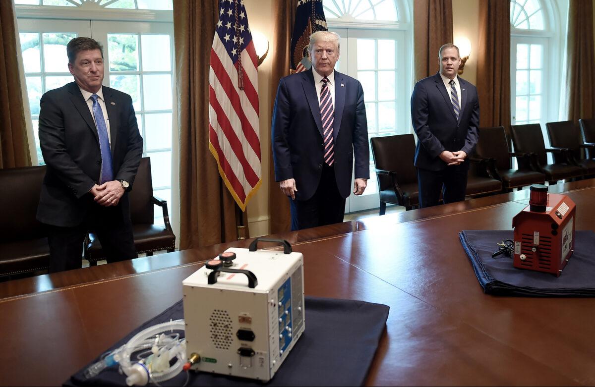 The VITAL (Ventilator Intervention Technology Accessible Locally), left, developed by engineers at NASAs Jet Propulsion Laboratory in Southern California, and AMBUstat, small, portable device that decontaminates spaces, sit on a table in the White House on April 24, 2020. (Olivier Douliery/AFP via Getty Images)