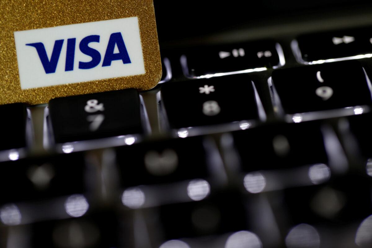 A Visa credit card is seen on a computer keyboard in this picture illustration taken on Sept. 6, 2017. (Philippe Wojazer/Reuters/Illustration)