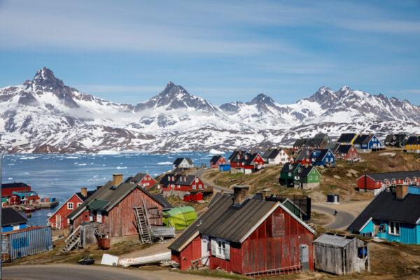 Snow-covered mountains rise above the harbor and town of Tasiilaq, Greenland, June 15, 2018. (Lucas Jackson/Reuters)
