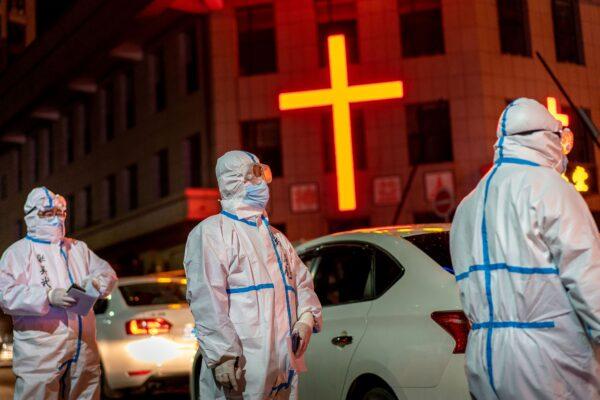 Medical workers are looking for close contacts with CCP virus patients in Suifenhe city, China on April 25, 2020. (STR/AFP via Getty Images)