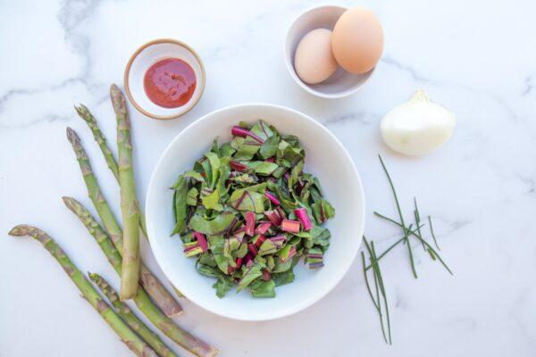 Stir-fry ingredients at the ready, including farm-fresh asparagus and beet greens. (Caroline Chambers)