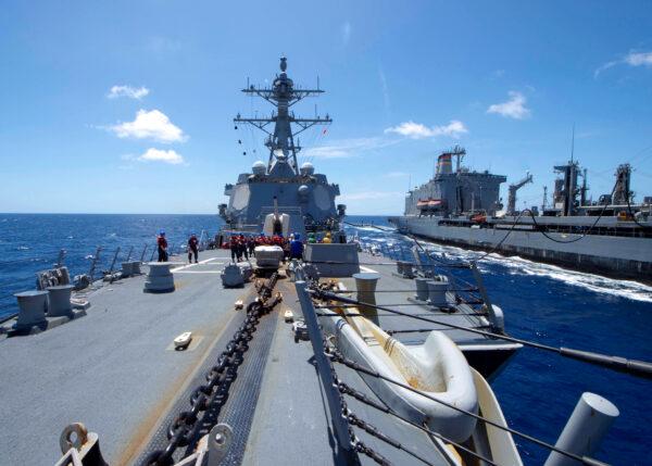 The U.S. Navy Arleigh Burke-class guided-missile destroyer USS Kidd receives fuel from the Military Sealift Command replenishment oiler USNS Guadalupe in the Pacific Ocean March 27, 2020. (U.S. Navy/Mass Communication Specialist 3rd Class Brandie Nuzzi/Handout via Reuters)