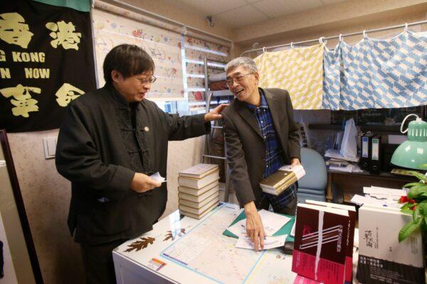 Lam Wing-kee, right, one of five shareholders and staff at the Causeway Bay Book shop in Hong Kong, works at his new book shop on the opening day in Taipei, Taiwan, on April 25, 2020. (Chiang Ying-ying/AP Photo)