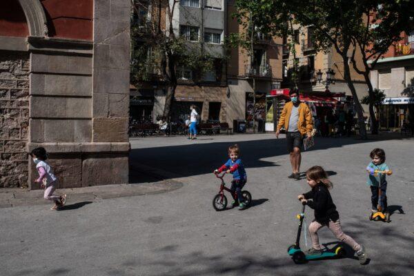 Children play at Plaça de la Vila de Gracia in Barcelona, Spainm on April 26, 2020. (David Ramos/Getty Images)