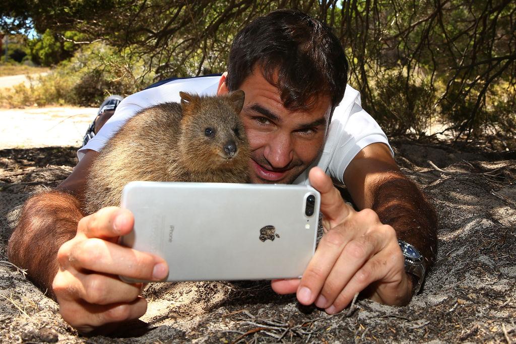 Roger Federer of Switzerland takes a selfie with a quokka at Rottnest Island, in Australia. (Paul Kane/Getty Images)