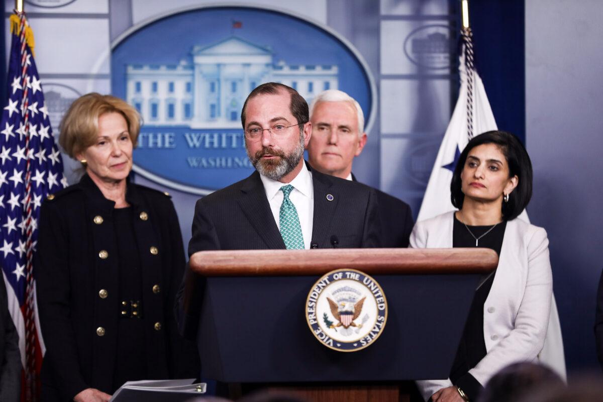 Health and Human Services Secretary Alex Azar speaks about the epidemic, flanked by White House coronavirus response coordinator Debbie Birx (L), Vice President Mike Pence, and Centers for Medicare and Medicaid Services Administrator Seema Verma (R), at the White House on March 2, 2020. (Charlotte Cuthbertson/The Epoch Times)