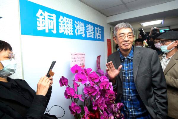 Lam Wing-kee, one of five shareholders and staff at the Causeway Bay Book shop in Hong Kong, waves to the press at his new book shop on the opening day in Taipei, Taiwan, on April 25, 2020. (Chiang Ying-ying/AP Photo)