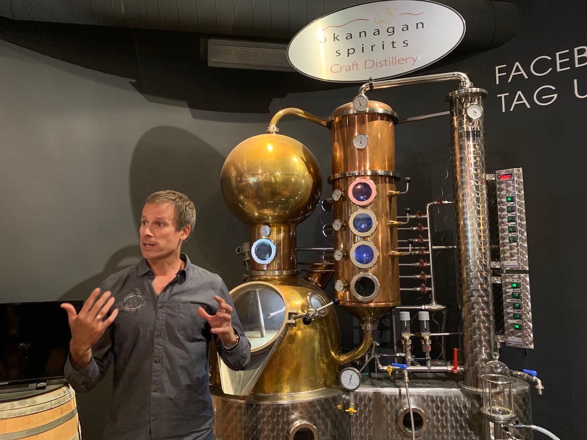 Tyler Dyck, CEO of Okanagan Spirits Craft Distillery and president of the Craft Distillers Guild of BC, explaining the still at Okanagan Spirits Craft Distillery. (Skye Sherman)