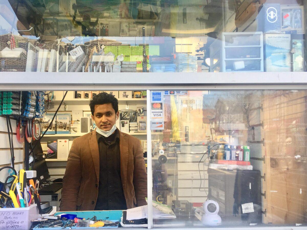M.D. Amin, 30, opened his mobile phone and computer repairing store at Jackson Heights, defying the administration order because it was difficult to feed his family, in New York on April 25, 2020. (Venus Upadhayaya/The Epoch Times)