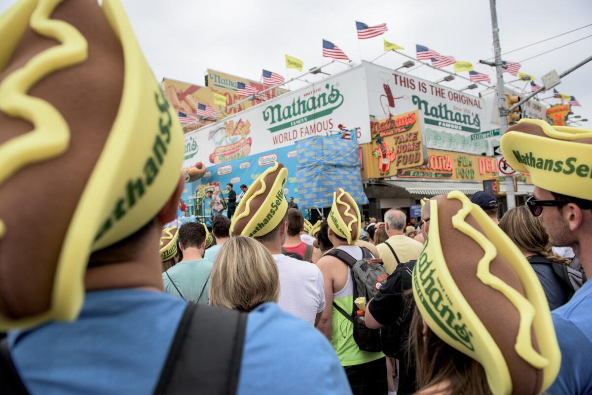 Fans gather at the Nathan's Famous Fourth of July hot dog eating contest on Coney Island, New York, on July 4, 2015. (Andrew Renneisen/Getty Images)