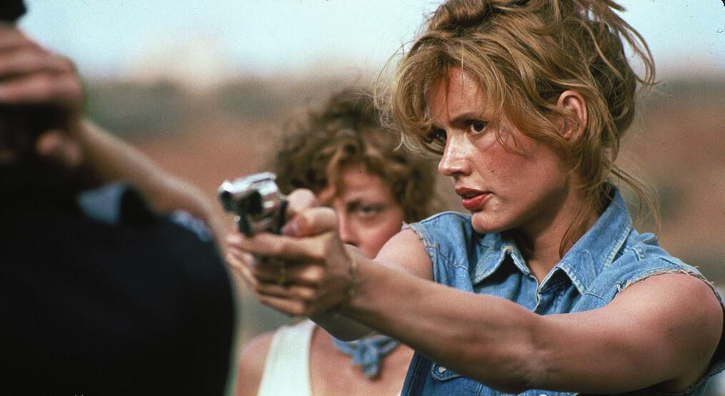Louise (Susan Sarandon, L) and Thelma (Geena Davis) turn the tables on a state trooper, in “Thelma & Louise.” (MGM)