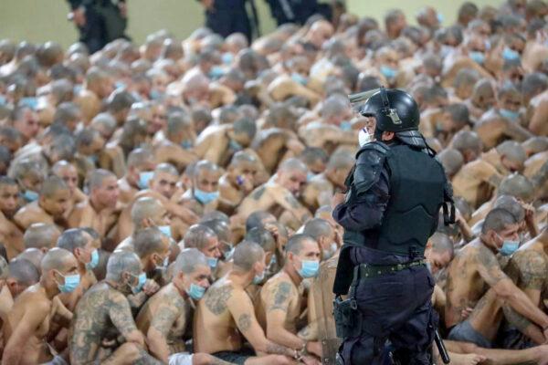 Gang members are secured during a police operation at Izalco jail during a 24-hour lockdown in Izalco, El Salvador, on April 25, 2020. (El Salvador Presidency/Handout via Reuters)