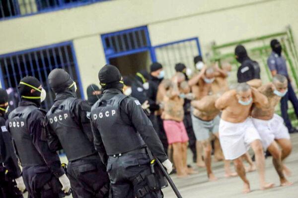 Gang members are secured during a police operation at Izalco jail during a 24-hour lockdown in Izalco, El Salvador, on April 25, 2020. (El Salvador Presidency/Handout via Reuters)