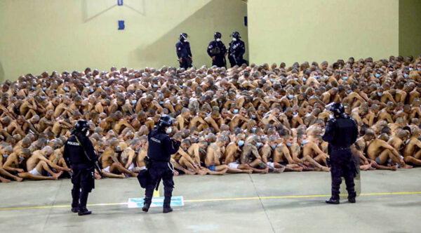 Gang members are secured during a police operation at Izalco jail during a 24-hour lockdown in Izalco, El Salvador, on April 25, 2020. (El Salvador Presidency/Handout via Reuters)