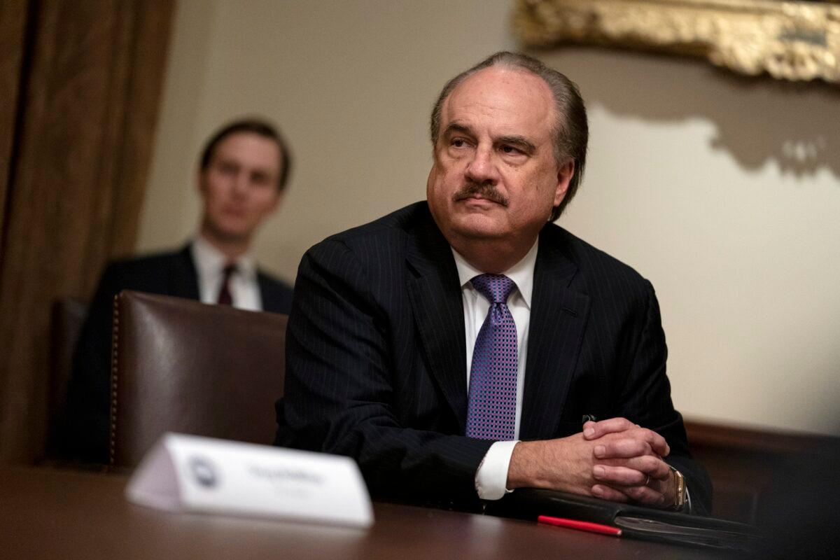 CVS CEO Larry Merlo listens during a meeting with President Donald Trump about CCP virus testing, in the Cabinet Room of the White House in Washington on April 27, 2020. (Evan Vucci/AP Photo)