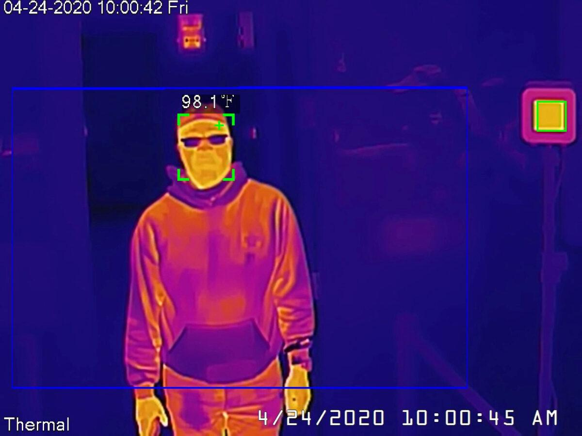 A Dahua thermal camera takes a man's temperature during a demonstration of the technology in San Francisco, Calif., on April 24, 2020. (Lewis Surveillance/Handout via Reuters)