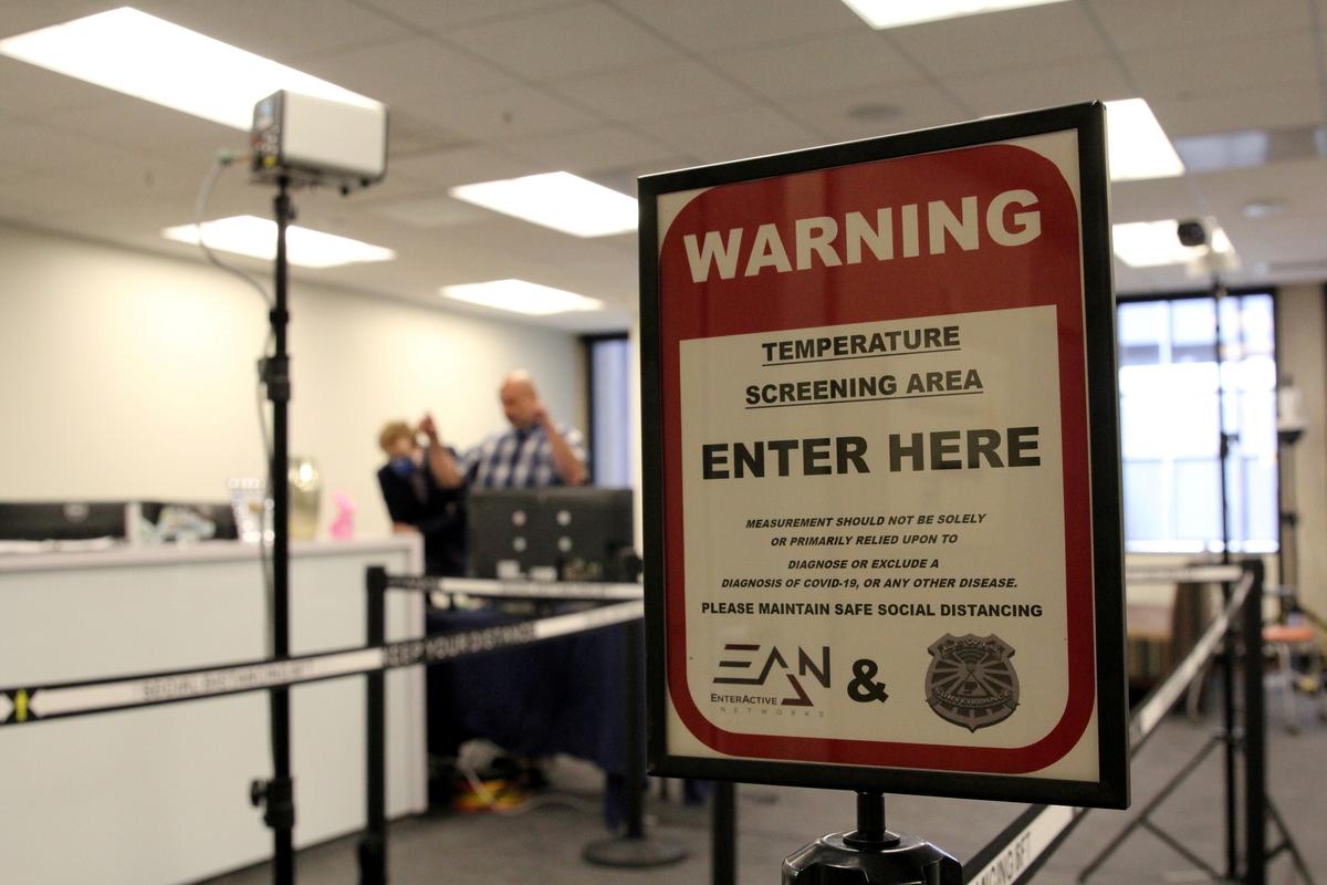 A temperature screening area is set up in an office to demonstrate the use of Dahua Technology's thermal imaging cameras in San Francisco, Calif., on April 24, 2020. (Nathan Frandino/Reuters)