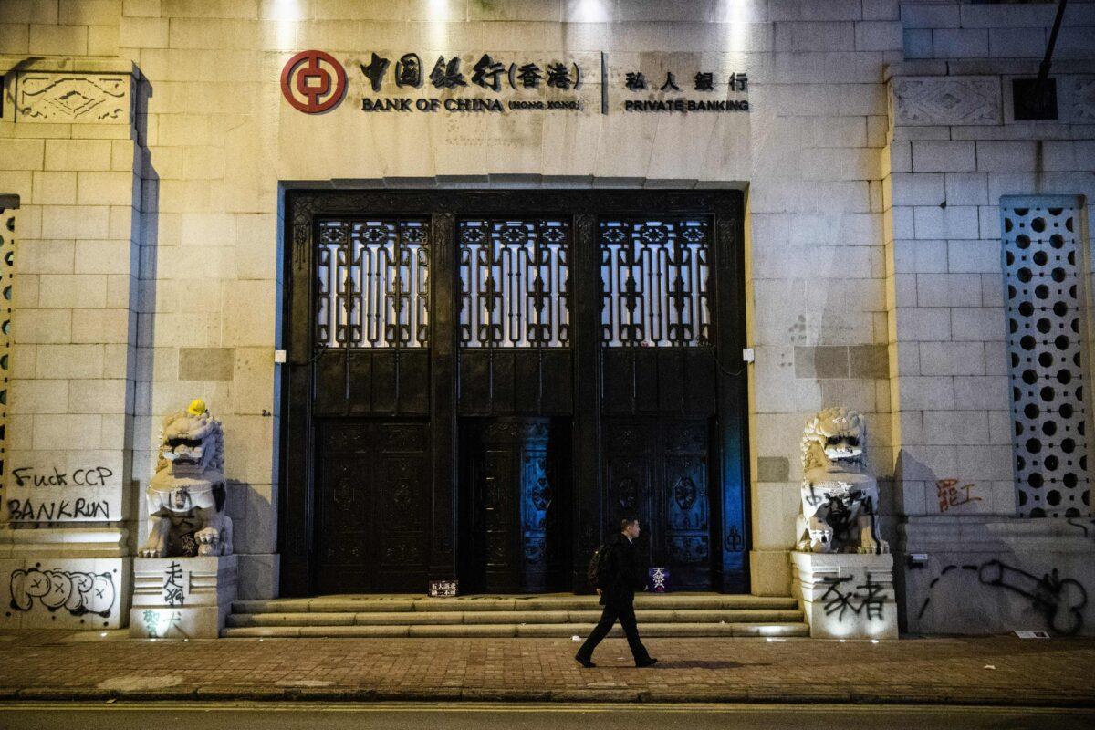A man walks past an old Bank of China building in Hong Kong in 2019. (Anthony Wallace/AFP via Getty Images)