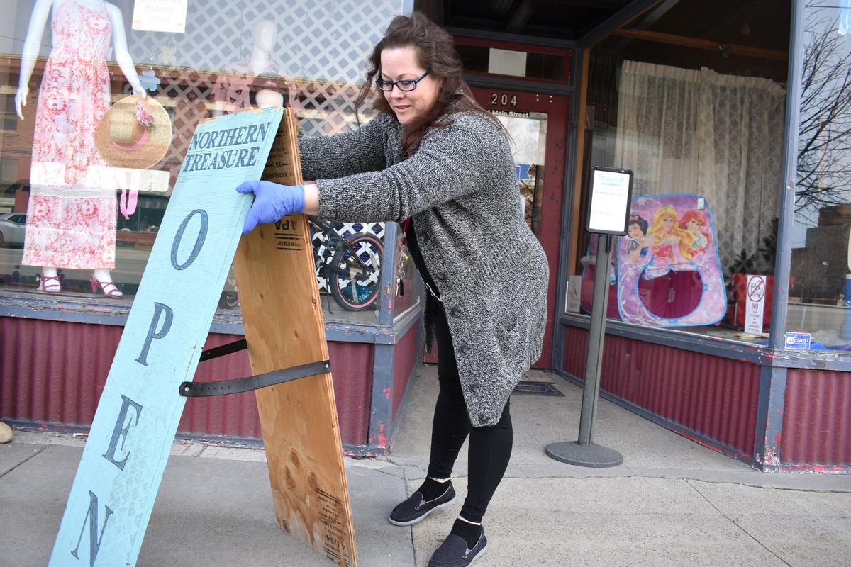 Nicole Snider opens the Northern Treasure thrift store in Roundup, Mont., on April 27, 2020. (Matthew Brown/AP Photo)