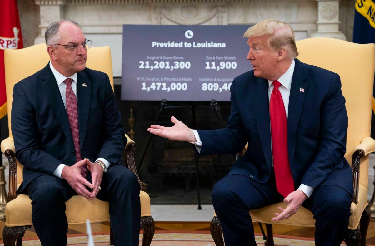 President Donald Trump meets with Louisiana Gov. Jon Bel Edwards (L) in the Oval Office of the White House in Washington on April 29, 2020. (Doug Mills/The New York Times/Pool/Getty Images)