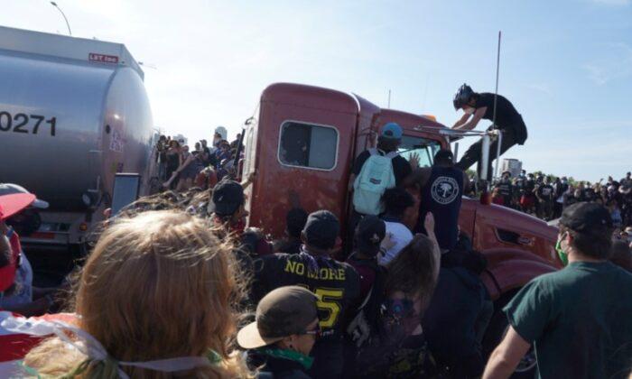 Semi Drives Toward Minneapolis Protesters Marching on Freeway