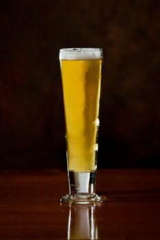 Pilsner glasses are tall and narrow, showing off the clarity and color of the beer. (Wollertz/Shutterstock)