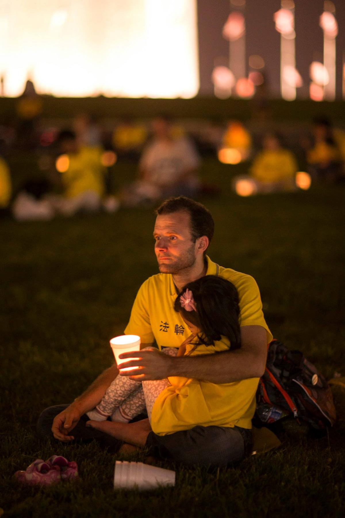 Nemanja at a candlelight vigil in Washington. (Edward Dye/The Epoch Times)