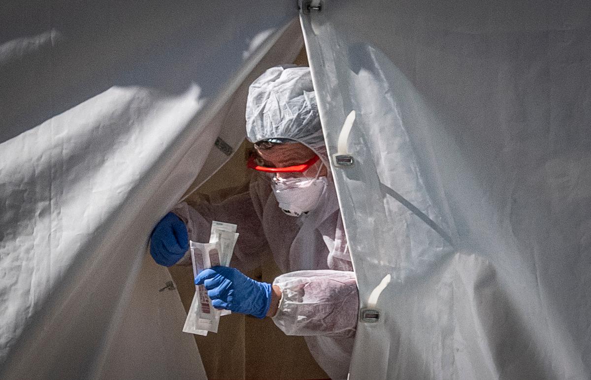 A medical employee exits from a tent at a testing point for COVID-19 in central Moscow on May 2, 2020. (Yuri Kadobnov/AFP/Getty Images)