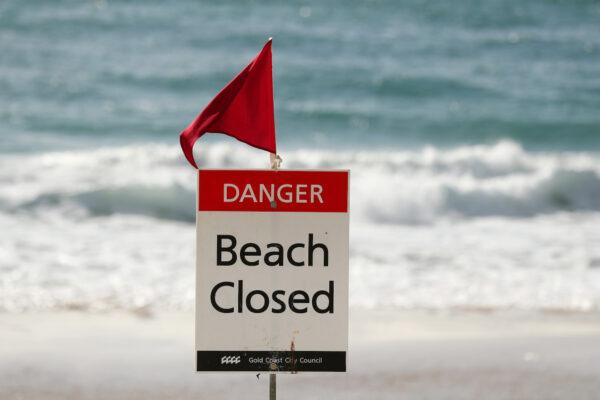 Beach Closed sign at Surfers Paradise beach on April 08, 2020 in Gold Coast, Australia. (Chris Hyde/Getty Images)