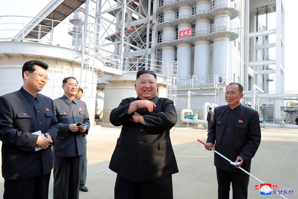 North Korean leader Kim Jong Un (C) visits a fertilizer factory in Sunchon, near Pyongyang, North Korea, on May 1, 2020. (Korean Central News Agency/Korea News Service via AP)