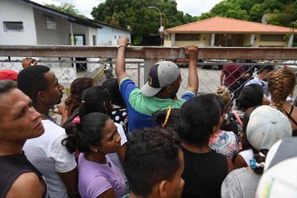 Relatives of prisoners killed on the eve during clashes at a police station jail in the town of Acarigua, in the Venezuelan state of Portuguesa, wait outside a hospital's morgue to be handed the bodies of their loved ones, on May 25, 2019. (Marvin Recinos/AFP/Getty Images)