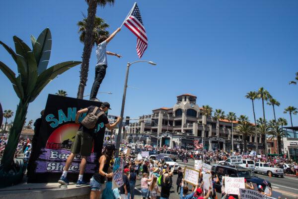 Protesters gather in a demonstration in Huntington Beach, Calif., on May 1, 2020. (Apu Gomes/Getty Images)