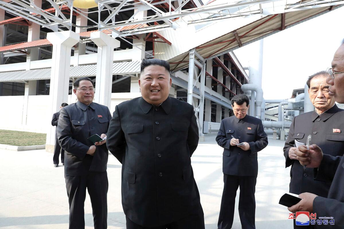 North Korean leader Kim Jong Un (C) visits a fertilizer factory in Sunchon, South Pyongan province, near Pyongyang, North Korea, on May 1, 2020. (Korean Central News Agency/Korea News Service via AP)