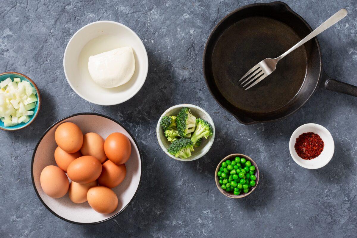 Gather your ingredients: eggs, milk, and all the leftover odds and ends in your fridge. (KucherAV/Shutterstock)