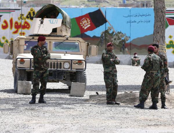 Afghan National Army soldiers keep watch at the site of a suicide attack in Kabul, Afghanistan, April 29, 2020. (Omar Sobhani/Reuters)