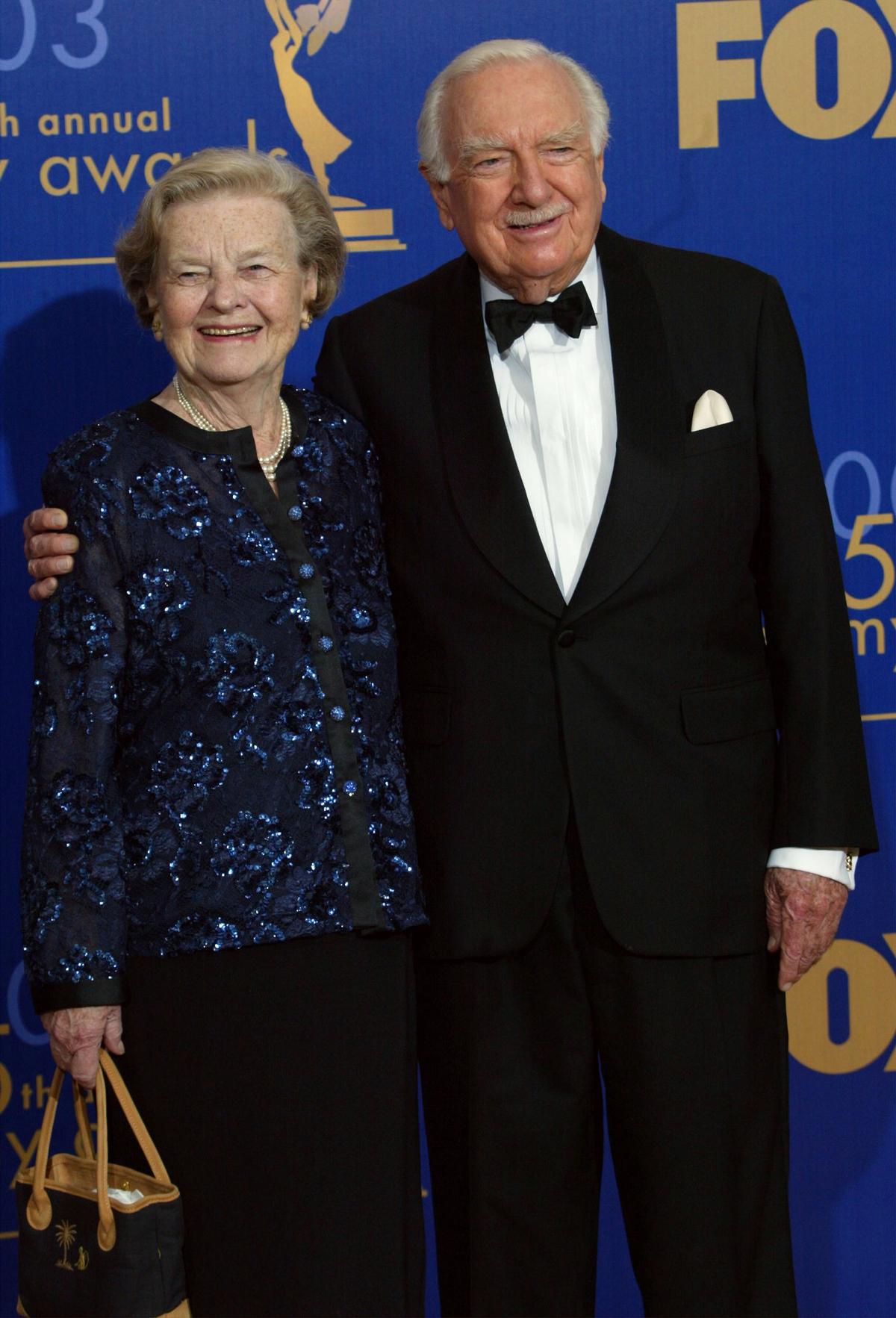 Betsy and Walter Cronkite pose backstage at the 55th Annual Primetime Emmy Awards at the Shrine Auditorium in Los Angeles, California, on Sept. 21, 2003. (Frederick M. Brown/Getty Images)