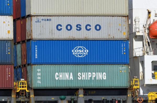 Containers of Chinese companies China Shipping and COSCO (China Ocean Shipping Company) are loaded on a container as it is leaving the port in Hamburg, Germany, on March 11, 2020. (Fabian Bimmer/File Photo/Reuters)